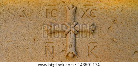greek othodox cross religious symbol carved in stone