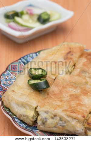 Martabak or murtabak is a stuffed pancake is arab food.