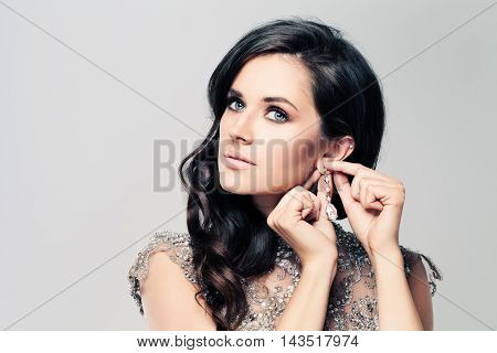 Fashionable beatiful Brunette Woman with Diamond Earrings