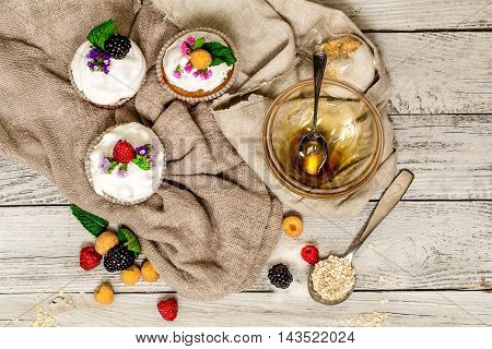 Beautiful Muffins With Berries On Wooden Background Nuts Honey