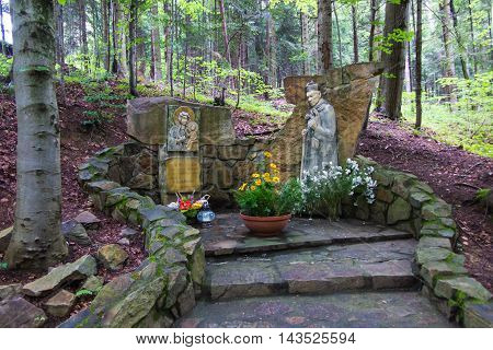Komancza Poland - July 20 2016: Chapel of Mary and the figure of the Polish primate Cardinal Wyszynski the woods next to the convent of the Sisters of Nazareth in Komancza. From 1955 to 1956 the monastery was interned Cardinal Stefan Wyszynski