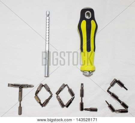 portable screwdriver for screwing and unscrewing screws with attachments