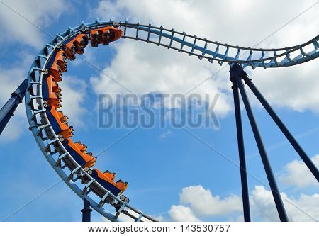 Roller coaster  ride filled  with thrill seekers