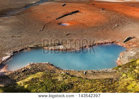 Beautiful blue hot spring. Artist's Paintpots area. Yellowstone National Park, Wyoming, USA