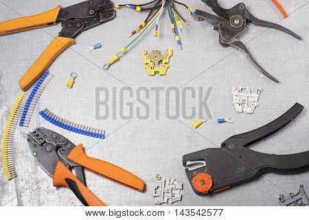 Set of electrical tool on wooden background. Accessories for engineering work, energy concept
