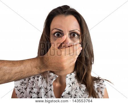 Hand covering the mouth of a girl wounded and frightened