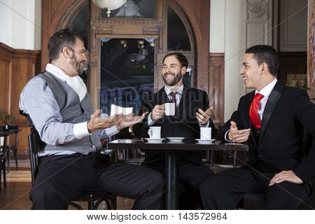 Tango Dancers Communicating While Sitting At Cafe Table