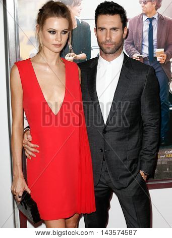 NEW YORK-JUNE 25: Behati Prinsloo (L) and Adam Levine attend the New York premiere of 