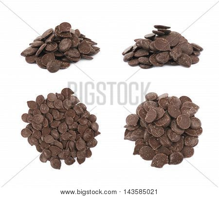 Pile of cooking chocolate teardrop shaped chips isolated over the white background, set of four different foreshortenings