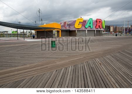Boardwalk view to the amusement park in the Coney Island New York