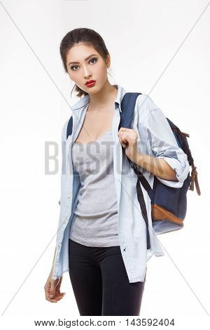 Portrait of teenager girl with school backpack isolated on white background. Good for sport and travel concept