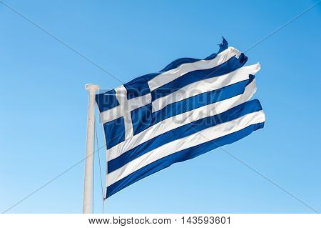 Old flag of the Greece in the wind