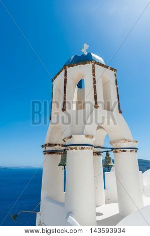 Bells tower in the blue sky of Oia - Santorini - Greece