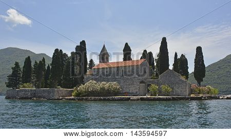 The tiny St George's Island in Kotor Bay Montenegro also known as the Island of the Dead. The island contains a 12th century Benedictine abbey and a cemetery.