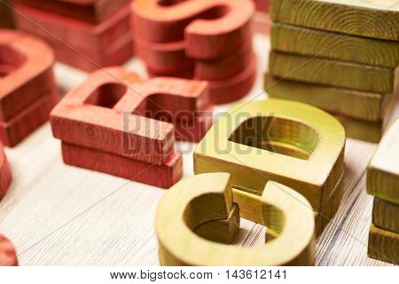 Surface coated with the multiple painted wooden block letters as an abstract backrop composition