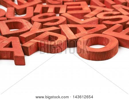 Surface coated with the multiple red painted wooden block letters isolated over the white background as a copyspace abstract backrop composition