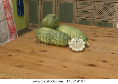 zucchini squash on the table in the kitchen in the countryside