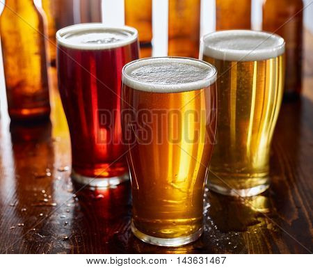 three types of beer, red ale, IPA, and stout