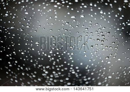 Abstract bokeh of light blurred defocused lights of cars on a wet rainy road backgrounds.