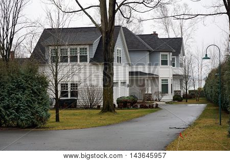 WEQUETONSING, MICHIGAN / UNITED STATES - DECEMBER 22, 2015: A large home with on Pennsylvania Avenue in Wequetonsing.