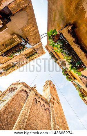 View from below on basilica dei Frari and houses in Venice