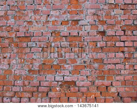 Old red brick cracked wall texture background