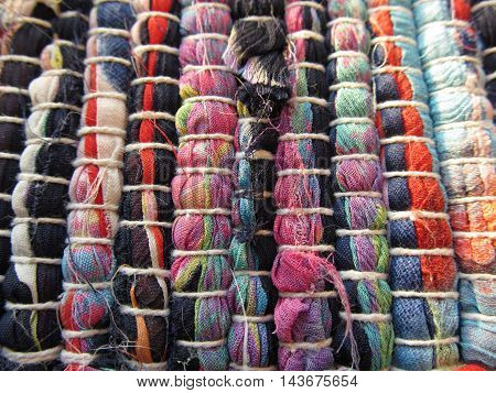 Bright cotton canvas textile rug texture close-up