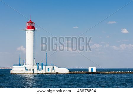 Lighthouse on the sea. Sunny summer day