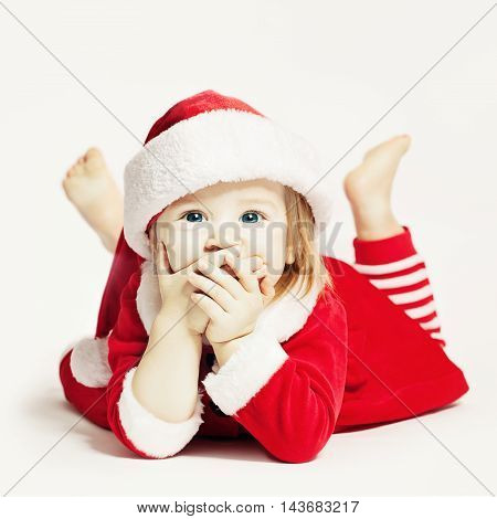 Happy Baby in Santa Hat. Infant Child Laughing