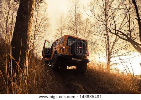 Leningrad oblast , Kirovsky district, Russia , December 25, 2015 , Jeep Wrangler in the woods, the Jeep Wrangler is a compact four wheel drive off road and sport utility vehicle
