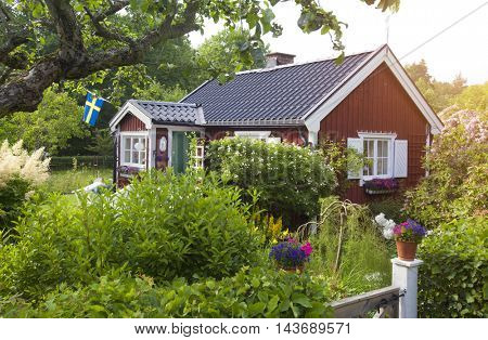 summer cottage with flower in the garden in sweden