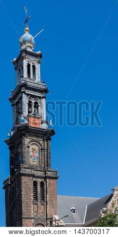 Amsterdam the Netherlands - August 16 2016: The tower of the Westerkerk is isolated against blue sky.