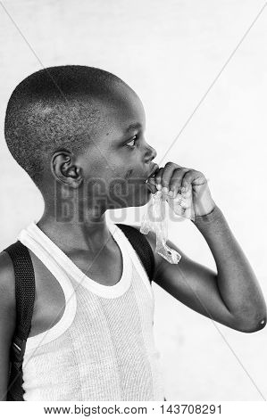 KARA, TOGO - MAR 9, 2013: Unidentified Togolese boy portrait. Children in Togo suffer of poverty due to the unstable econimic situation