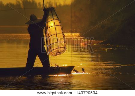Fishermen fishing in the morning Mekong River Thailand.