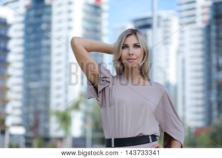 beautiful young woman posing outdoors 