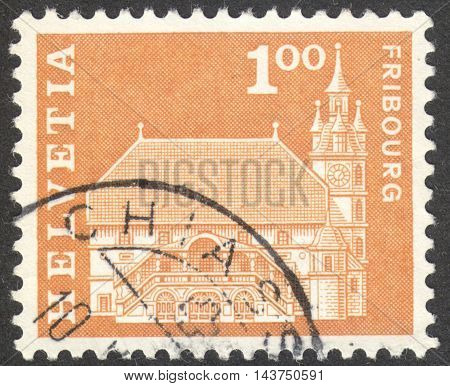 MOSCOW RUSSIA - CIRCA JUNE 2016: a post stamp printed in SWITZERLAND shows Town hall Fribourg Switzerland circa 1960
