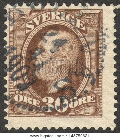 MOSCOW RUSSIA - CIRCA JULY 2016: a post stamp printed in SWEDEN shows a portrait of King Oscar II the series "King Oscar II" circa 1891 -1903