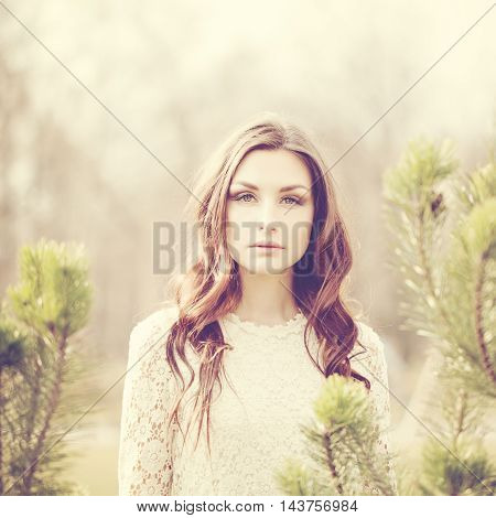 Fashion Portrait of Beautiful Woman with dark hair Outdoors