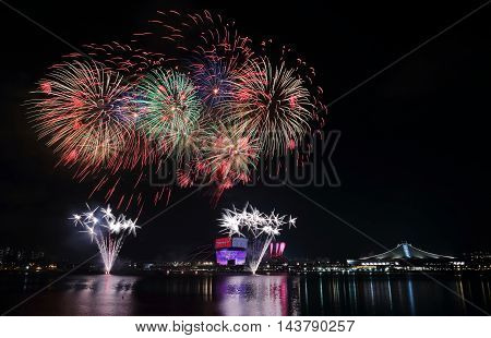 Fireworks celebrating Singapore national day across the Kallang River