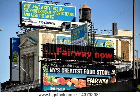 New York City - August 29 2011: Advertising signs cover a storage warehouse on West 130th Street in upper Manhattan (DT EXCL)