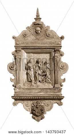 Low relief with religious scenes on the wall of a house in the historic center of Riga