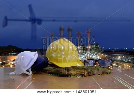 Work safety concept : work out door at construction site during used personal protective equipment   by hard hat .