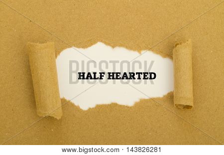 HALF HEARTED word written under torn paper.