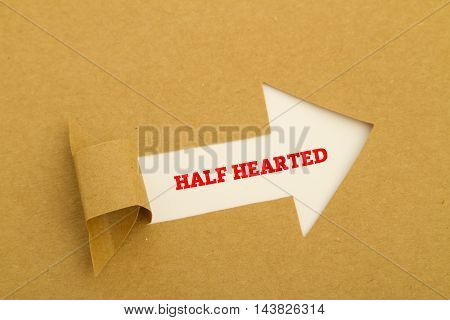 HALF HEARTED word written under torn paper.