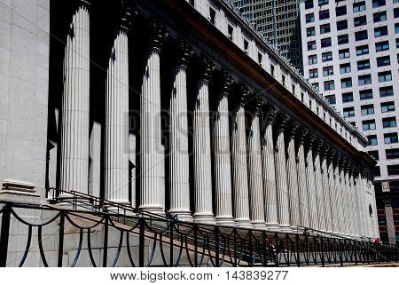 New York City - July 4 2009: The imposing United States Post Office at Eighth Avenue and West 32nd Street with its classical east front lined with massive Corinthian columns