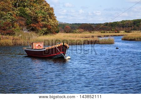Fishing Boat At Rest In a Marshy Pond Cape Cod Massachusetts