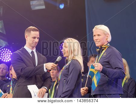STOCKHOLM SWEDEN - AUG 21 2016: Swedish female wrestler Jenny Fransson and Sofia Mattson getting interviewed when swedish olympic athletes are celebrated in Kungstradgarden 