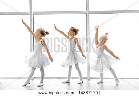 Cute girls practicing ballet in class