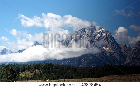 The Grand Tetons mountains with the clouds