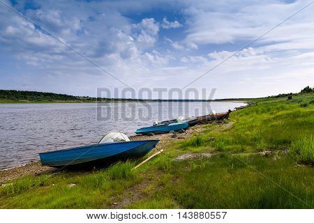 Boats on the river bank of the North Dvina